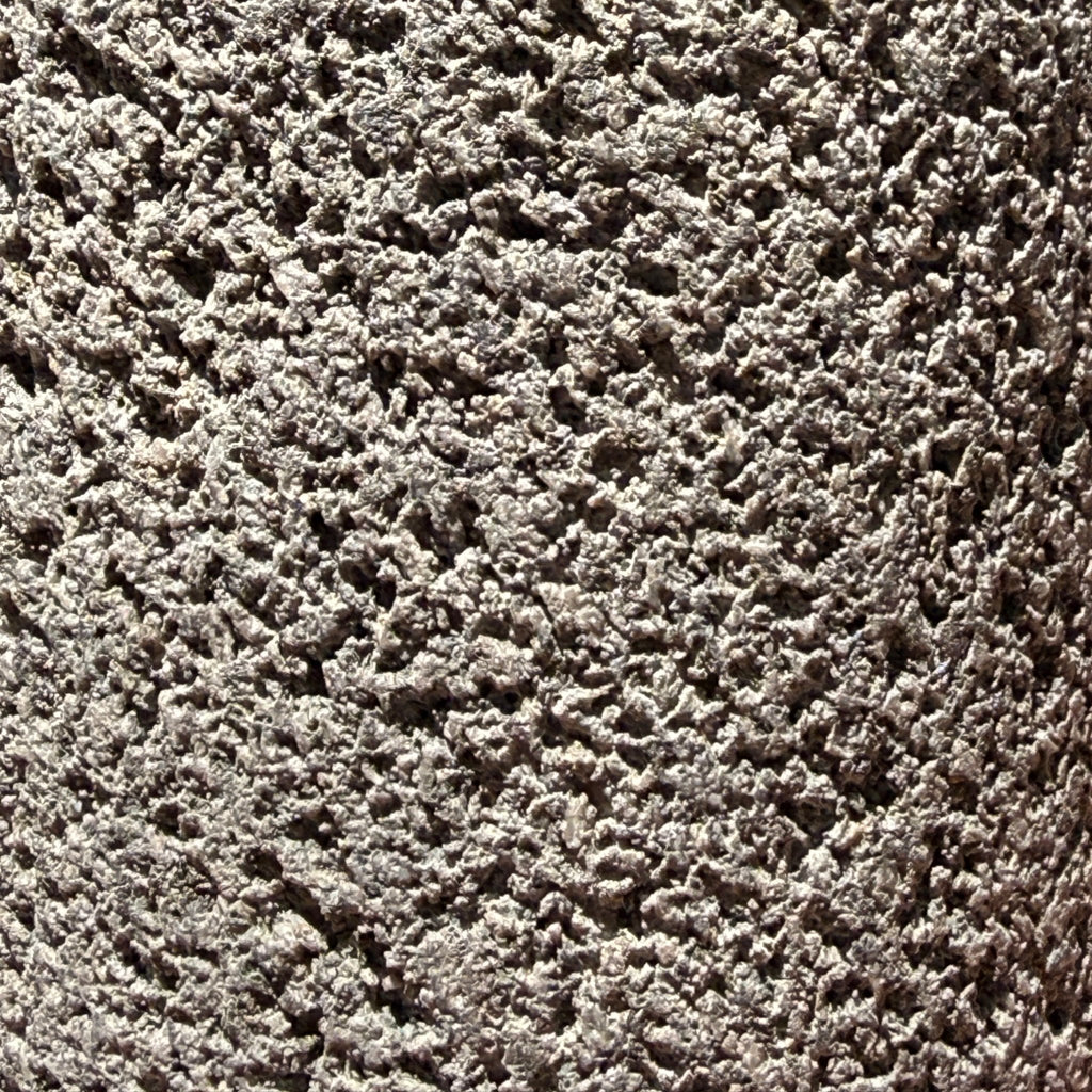 Lava rock soap dispenser with steel pump texture detail