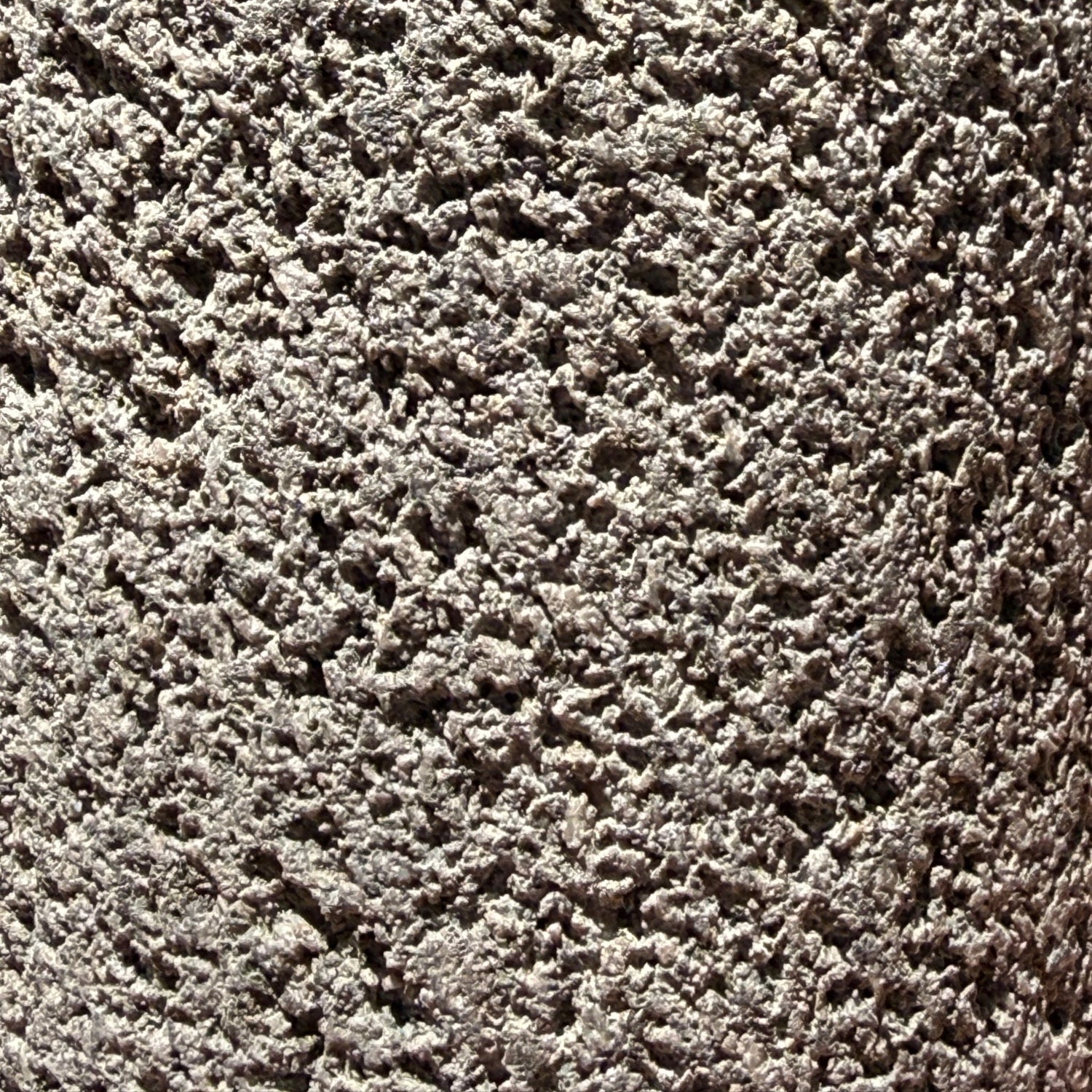 Lava rock soap dispenser with steel pump texture detail